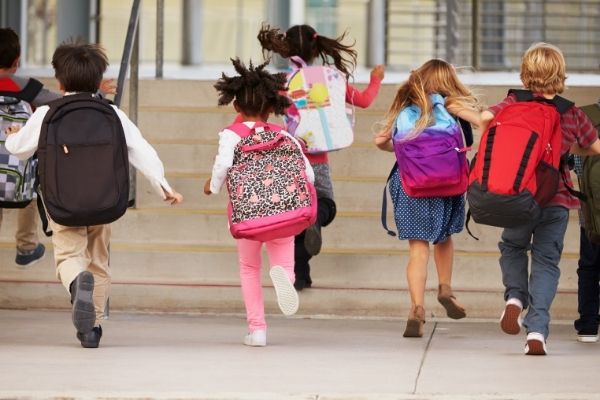 kids running into school