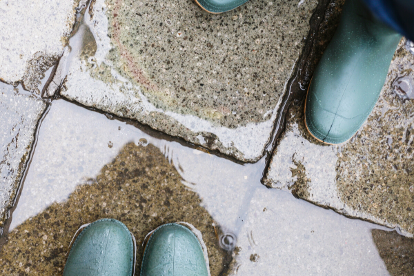 Boots on wet pavement 