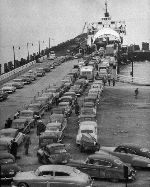 photo of lines of cars waiting to cross the Mackinac Strait on a ferry in the 1950s