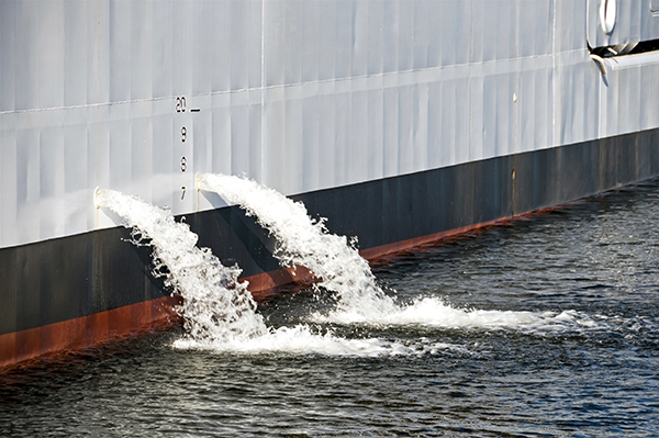 Ballast water pouring from ship