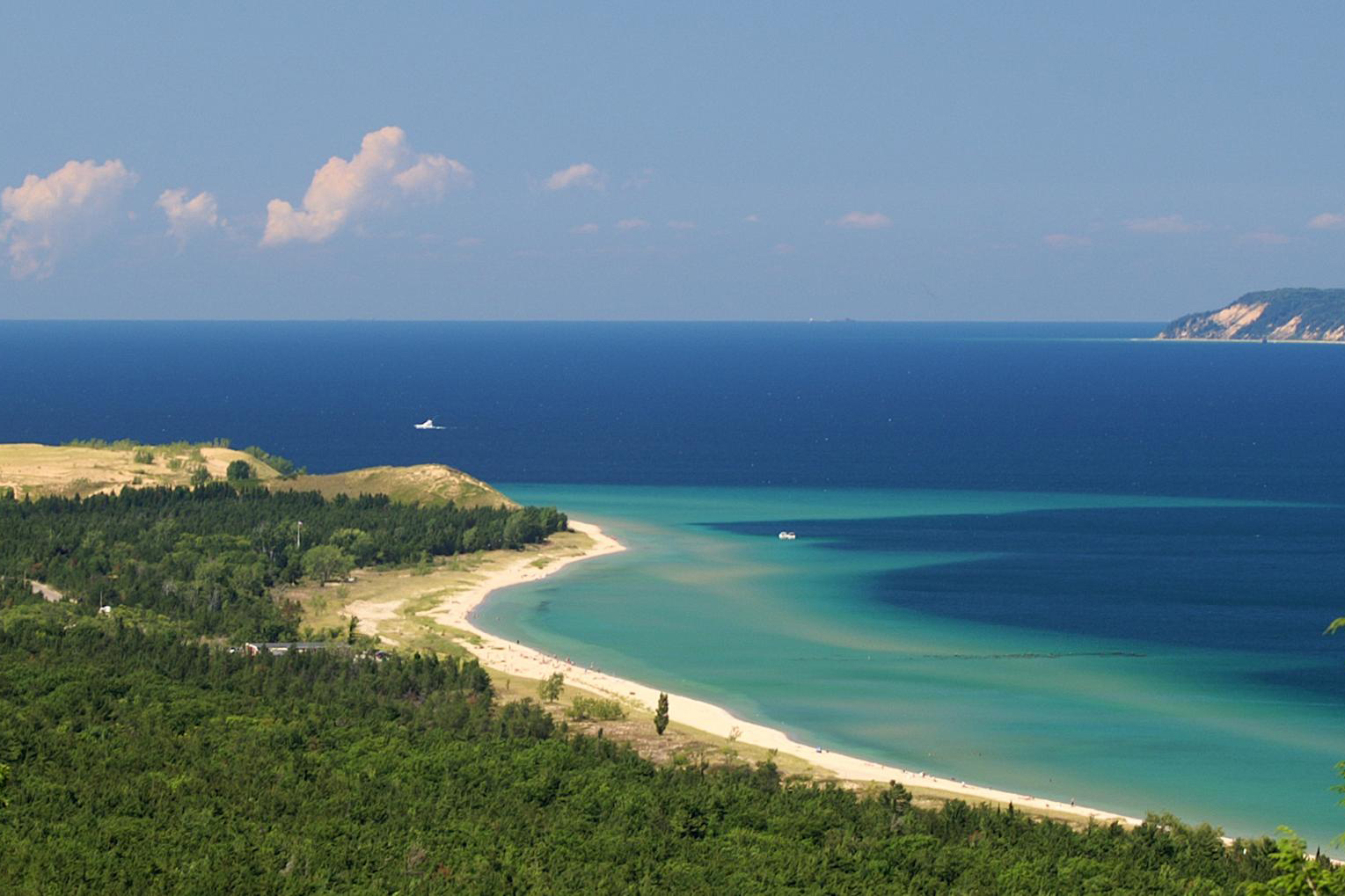 Photo of Sleeping Bear Dunes with one of the Manitou Islands on the right side of image