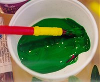 Paintbrush in paint Paintbrush in paint
