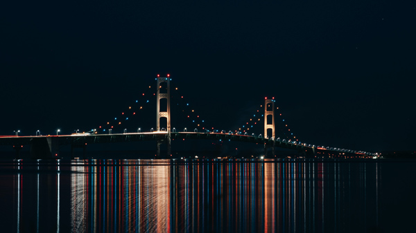 Mackinac Bridge-photo by Jordon Brown a photo of the Mackinac Bridge at night with lights outlining its shape