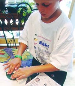 Child pressing leaf Child pressing leaf