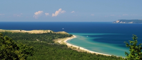 Photo of Sleeping Bear Dunes with one of the Manitou Islands visible in the distance